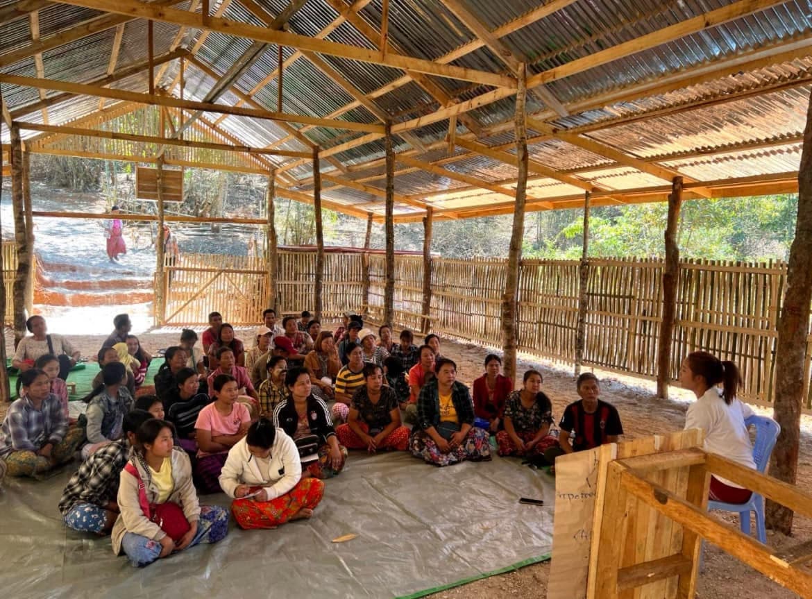 Children studying inside a temporary classroom
