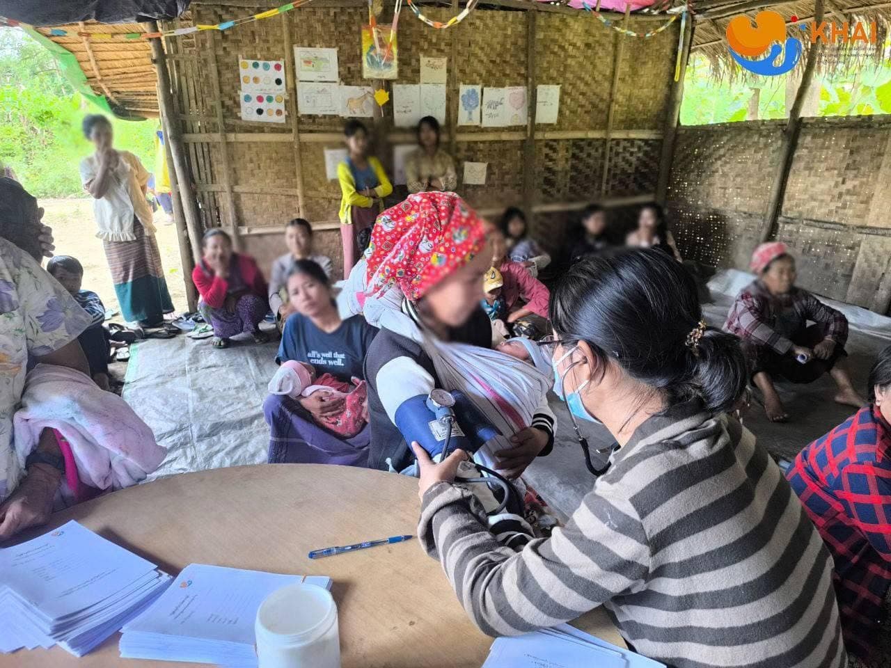 Health worker attending to a community member